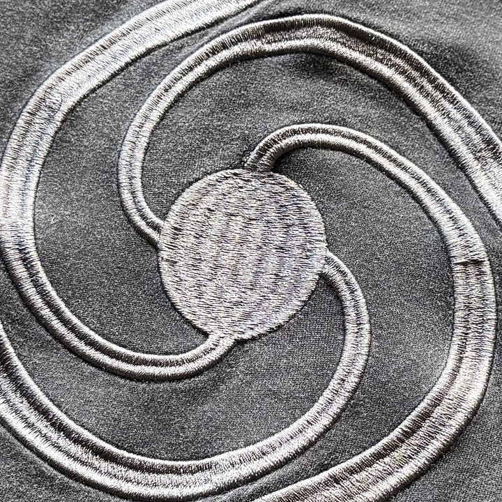 Hanten Polo (Stone), close-up: back embroidery
