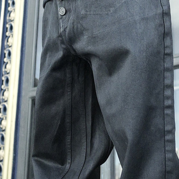 Shibuya Wax Jeans, close-up: coated texture