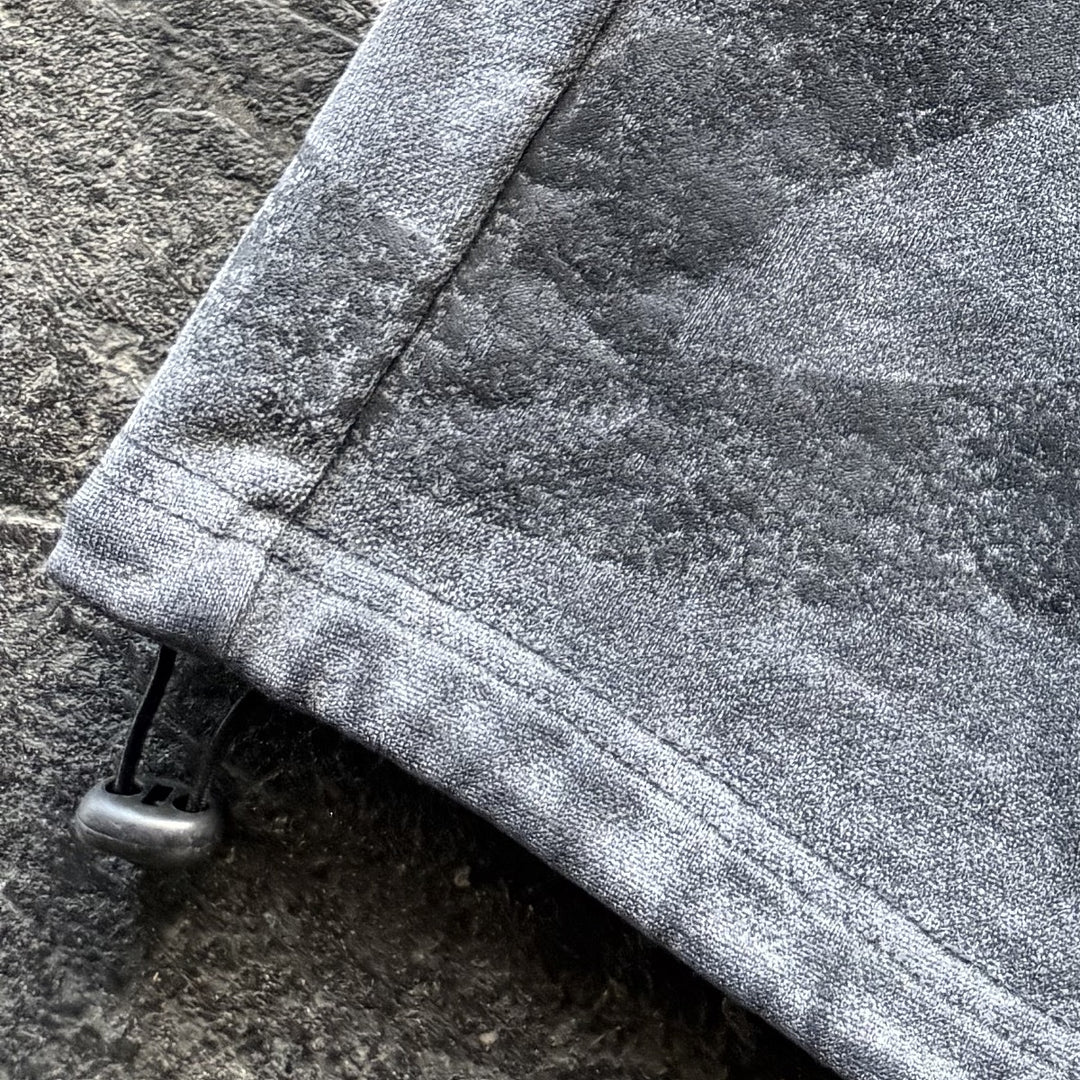 Uzumaki Shorts (Stone), close-up: print hem toggle