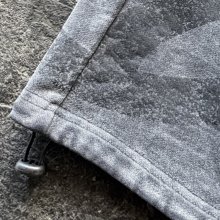 Uzumaki Shorts (Stone), close-up: print hem toggle